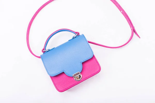 Kvinders håndtaske i blå og lyserøde farver - Stock-foto