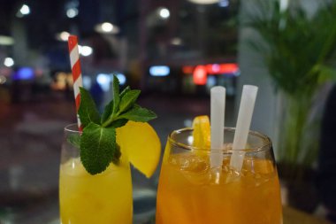 Two cocktails with citrus