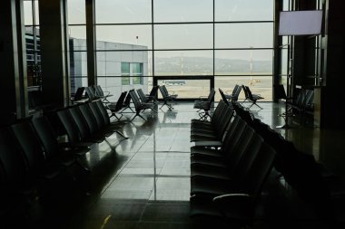 Modern airport: comfortable seats and big window in new airport, no people