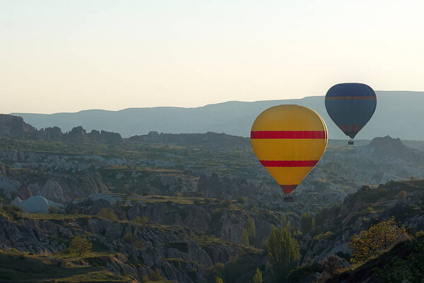 Cappadocia yellow air balloon above hills