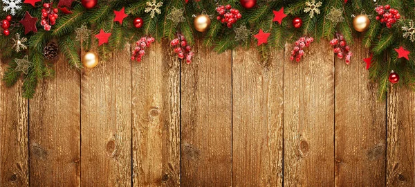 Christmas wooden banner with decoration and fir tree. View with copy space.