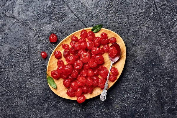 Candied dried cherry on plate. Top view of berries.