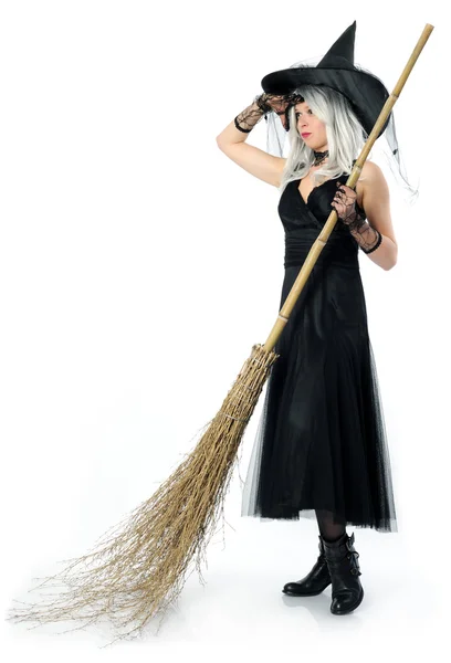 Beautiful witch with broom — Stock Photo, Image