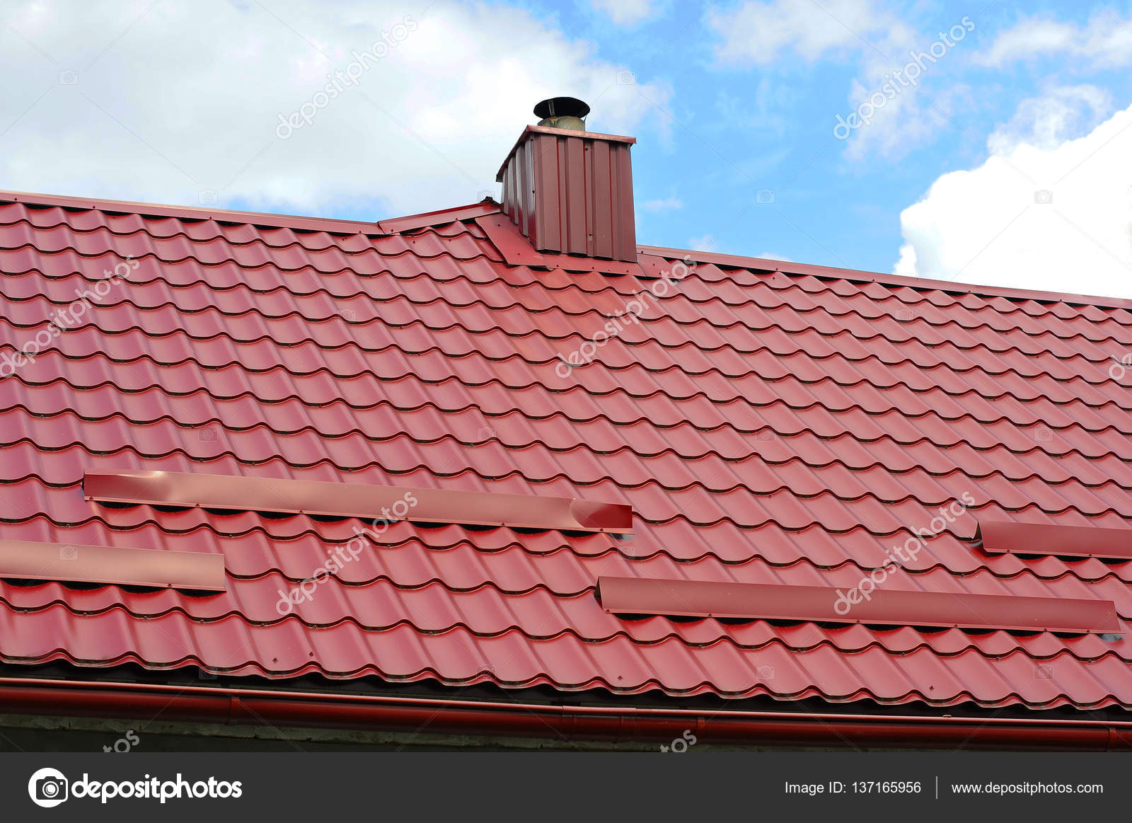 Closeup on new chimney pipe and roof protection from snow board (Snow