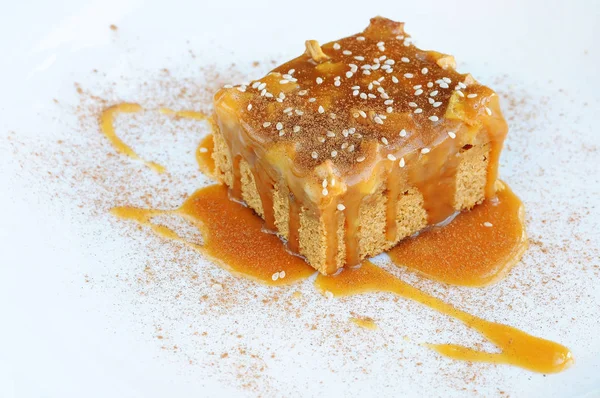 Apple caramel cake on a white background.