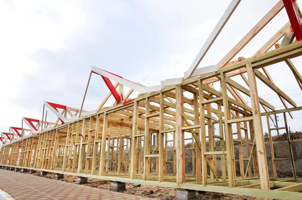 The wooden structure of the building. Wooden frame building. Connection and fastening of beams in the construction of buildings