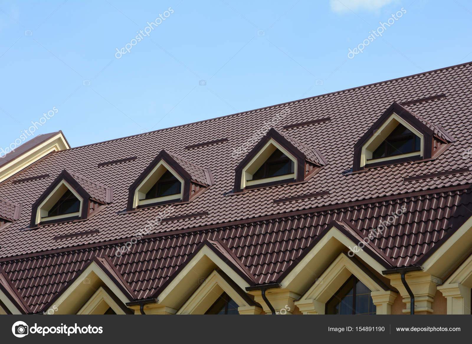 Dormer Windows On Metal Roof A House With A Roof Made Of Metal