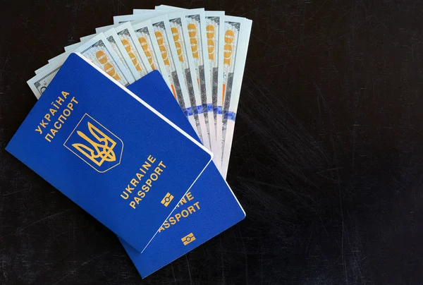 Many hundred dollars and two Ukrainian blue passports. Ukrainian foreign passport. Corruption in Ukraine — Stock Photo, Image