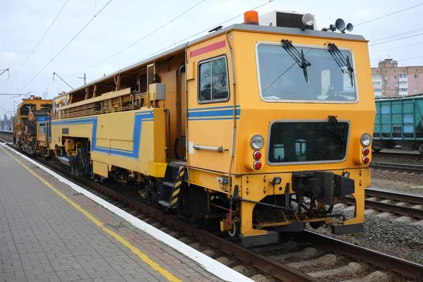 Technical railway repair train. View on the maintenance train on railroad track.