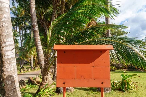 stock image notice board under the palm tree