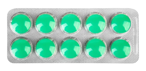 Blisterförpackning med tio rosa piller på vit bakgrund — Stockfoto