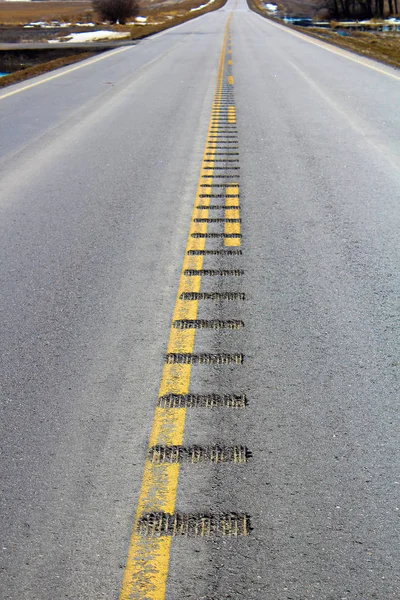 Center line rumble strips down a lonely country road