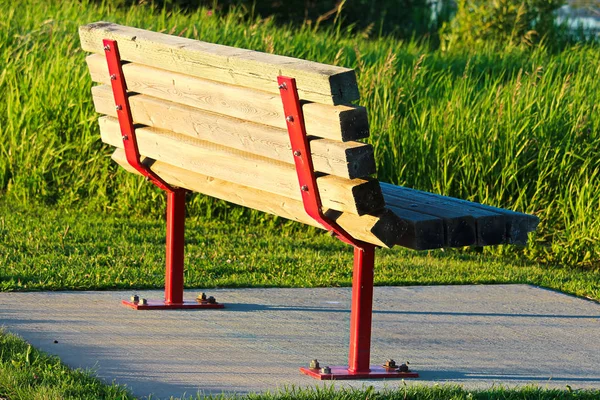 A park bench on a concrete base — Stock Photo, Image