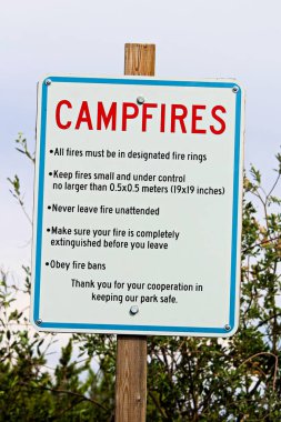 A campfire rules and reminder sign clipart