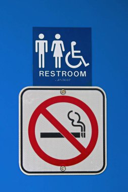 A no smoking sign at a rest stop clipart