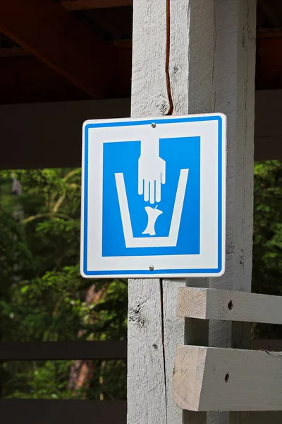 Closeup of a composting waster sign on a wooden post — Stock Photo, Image