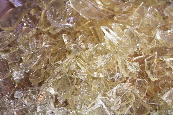 A pile of clear hard candy glass