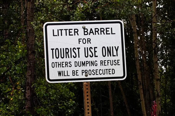 A litter barrel for tourist use only sign — 스톡 사진
