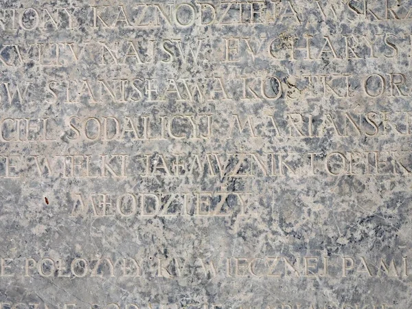 Latin letters engraved on a stone slab