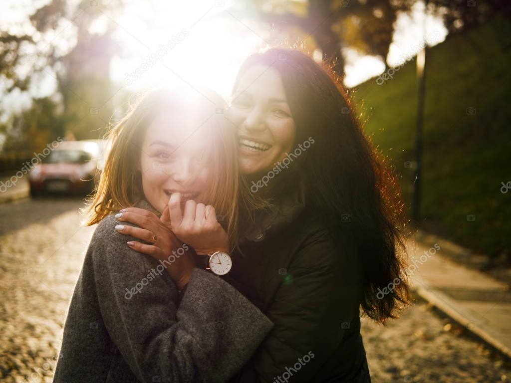 Portrait of girls, brunette and red, sun, autumn