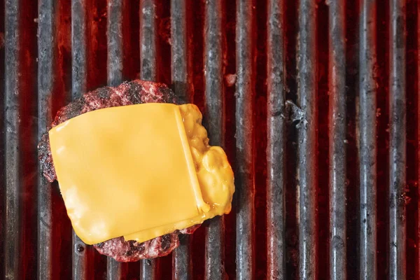 Cutlet with cheese for burger is grilled — Stock Photo, Image