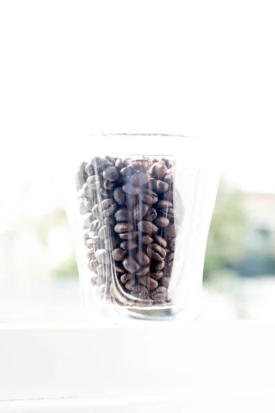 Roasted coffee beans in a glass for breakfast — Stock Photo, Image