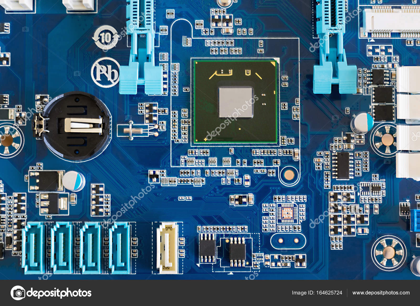 A fragment of a computer motherboard with a north bridge and connectors — Stock Photo