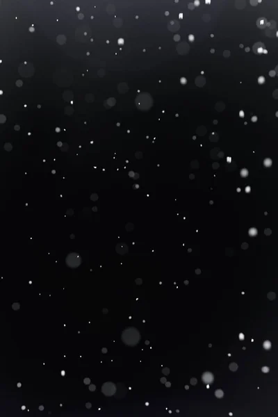 Настоящий снег на черном фоне — стоковое фото