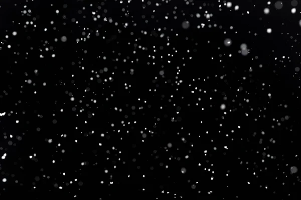 Nieve real sobre fondo negro — Foto de Stock