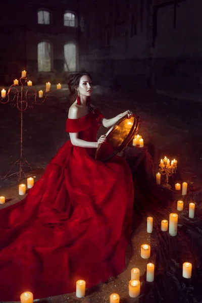 Beautiful lady with candles — Stock Photo, Image