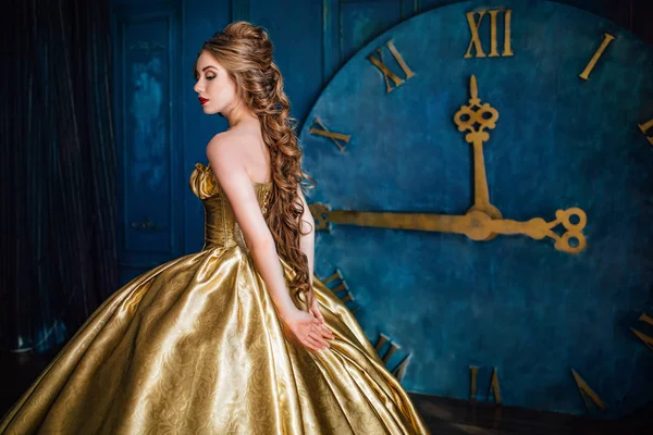 Beautiful woman in a ball gown — Stock Photo, Image