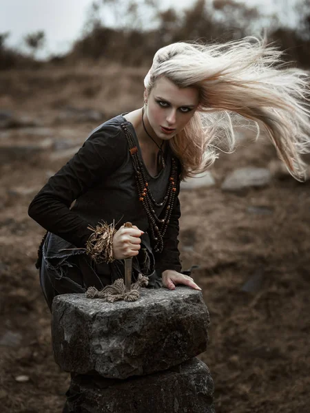 Witch in a long black dress — Stock Photo, Image