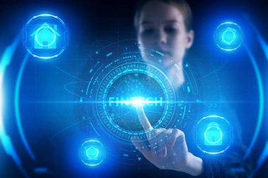 İş, Teknoloji, İnternet ve ağ konsepti. Genç işadamı geleceğin sanal ekranı üzerinde çalışıyor ve Fintech yazısını görüyor.