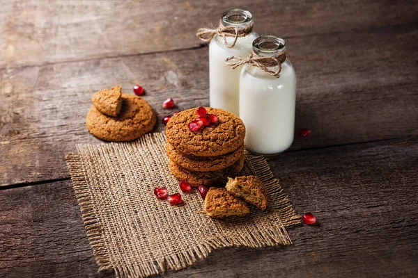 Drinking yogurt in bottles and cookies, selective focus — Stock Photo, Image