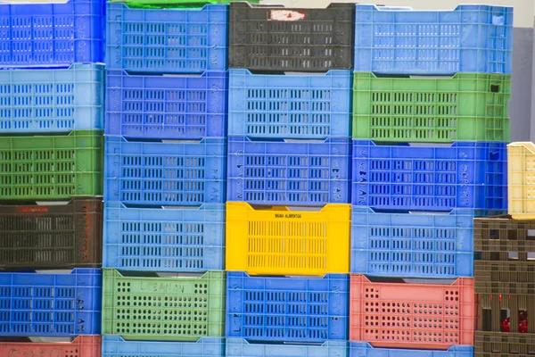 plastic cases piled in rows, closeup