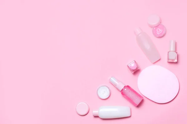 Pink decorative cosmetic on pink background.