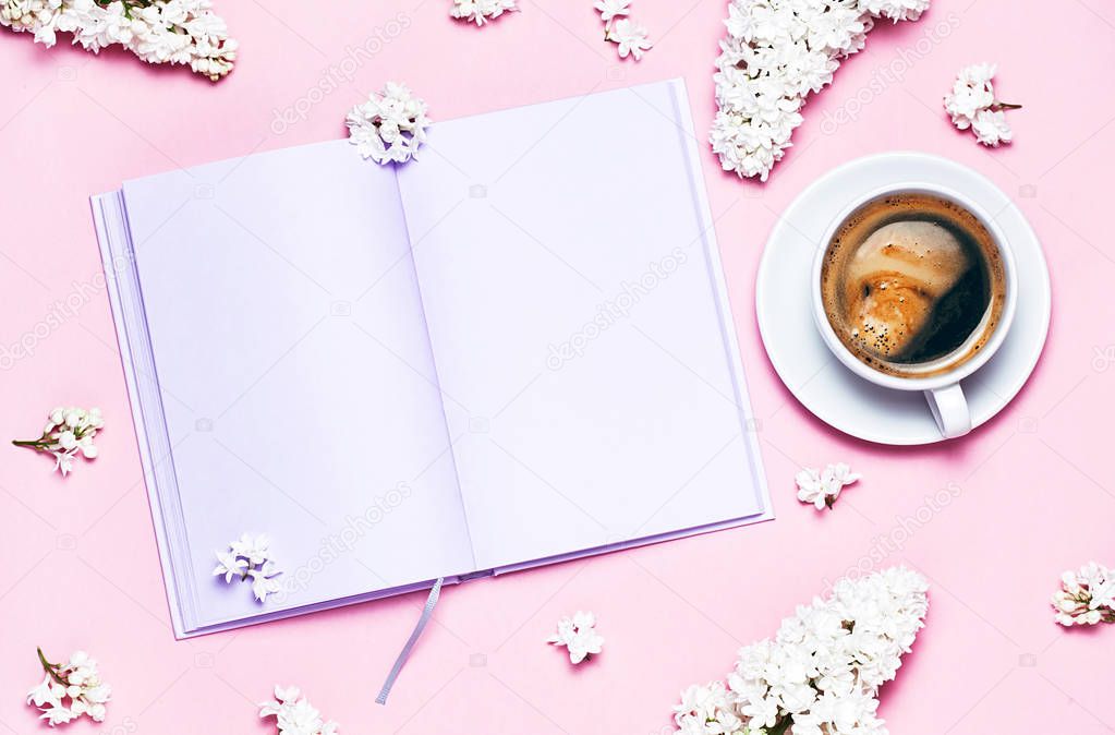Notebook. lilac flowers and coffee cup