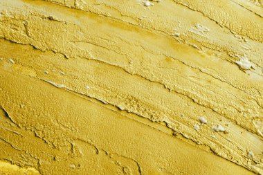 Altın boya dokusu. Makro görünüm.