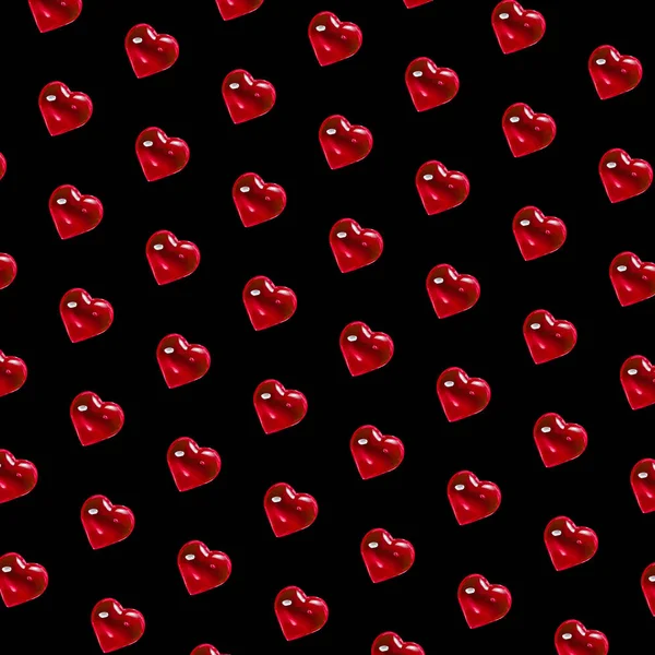 Valentýn v pozadí. Vzor ze skleněných rudých srdcí na černém pozadí. Minimalismus karet, Symbol lásky — Stock fotografie