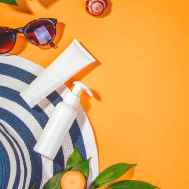 Sunprotection objects. Hat with sunglasses and protection cream SPF Beach accessories. Summer Travel Vacation Concept