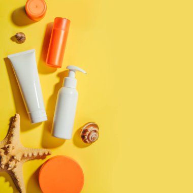 Sunprotection objects, suscreen. Prevention of photoaging. Flat lay, natural cosmetics, cream SPF for face and body. Summer Travel Vacation Concept