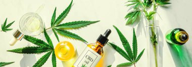 Various glass bottles with CBD oil, THC tincture and hemp leaves on a marble background. Flat lay, minimalism. Cosmetics CBD oil clipart