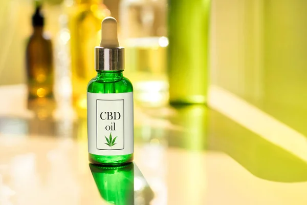 Glass bottle CBD OIL, tincture awith label on background of the laboratory cannabis oil — Stock Photo, Image