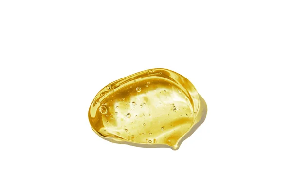 Siero di vitamina C, texture gel cosmetico. Gel giallo trasparente con bolle in una bella striscia — Foto Stock
