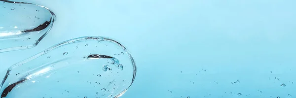 Textura de ácido hialurônico, gel de soro. Esfregaço transparente de gel isolado em fundo branco Banner — Fotografia de Stock