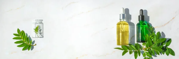 Serum with herbal extracts for skincare. Flat Lay minimalism Banner