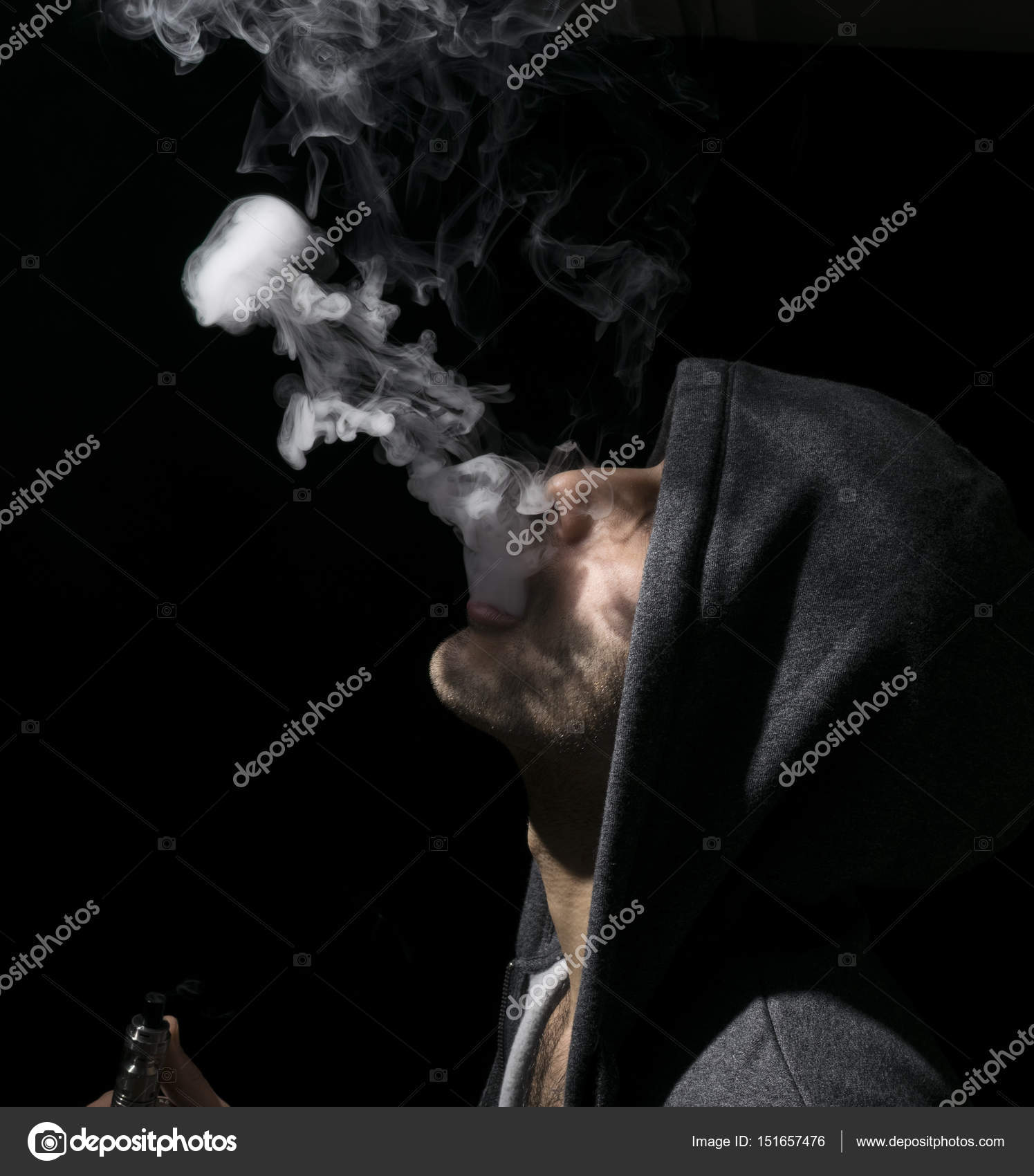 Isolated man doing a jellyfish trick of vaping and electronic ci Stock