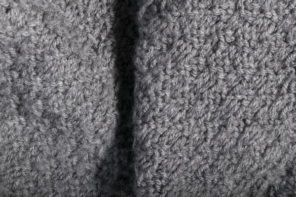 Isolated handmade knitted gray fabric in details. — Stock Photo, Image