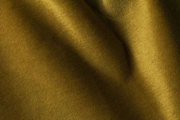 Gyllene velour tyg bakgrund, sammet, mohair, cashmere effekt. — Stockfoto