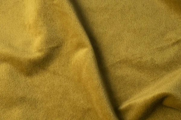 Golden velour fabric background, velvet, mohair, cashmere effect . — стоковое фото